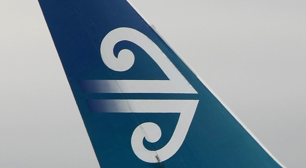 Air New Zealand logo on tail fin of plane.