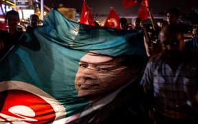 People take to the street in support of President Recep Tayyip Erdogan July 16, 2016 in Antalya, Turkey.