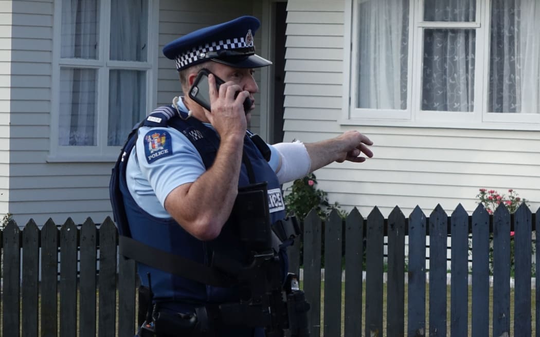Police have evacuated residents of a Porirua street, north of Wellington, as they hunt for an armed offender who shot dead a police dog.