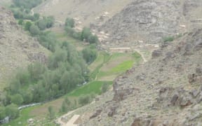 The authors said this photo showed the village of Naik in summer. They said the other village that was attacked was nearby, about 1km behind the ridge on the left of the photo.