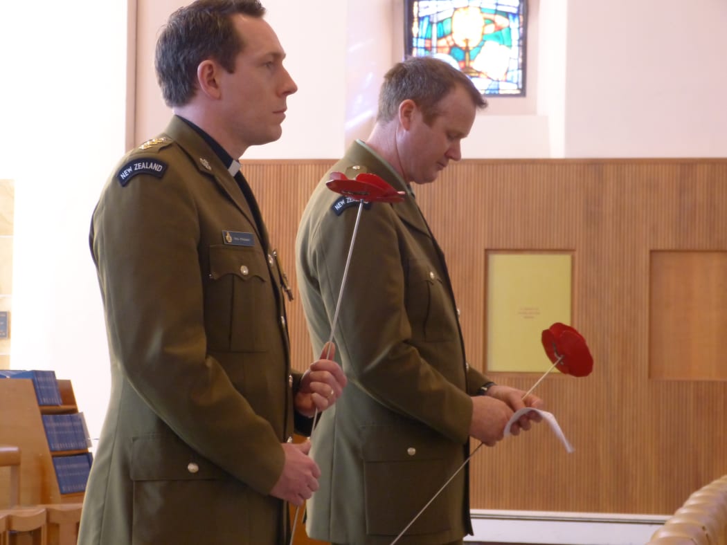 Soldiers lay poppies to mark 100 years since the death of NZDF chaplain William Grant.