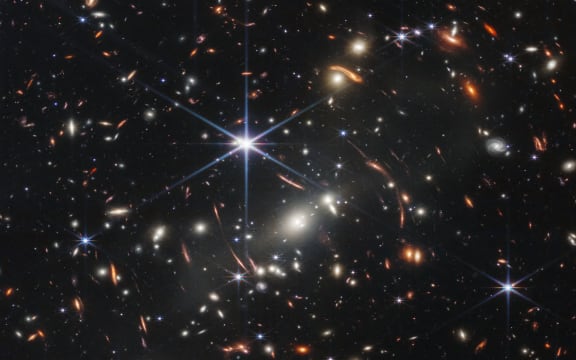 In this handout photo from NASA obtained on July 11, 2022, the first infrared image from the James Webb Space Telescope (JWST) is seen. - The JWST is the most powerful telescope launched into space and it reached its final orbit around the sun, approximately 930,000 miles from Earths orbit, in January, 2022. The technological improvements of the JWST and distance from the sun will allow scientists to see much deeper into our universe with greater detail. (Photo by Handout / NASA / AFP) / RESTRICTED TO EDITORIAL USE - MANDATORY CREDIT "AFP PHOTO / NASA" - NO MARKETING NO ADVERTISING CAMPAIGNS - DISTRIBUTED AS A SERVICE TO CLIENTS