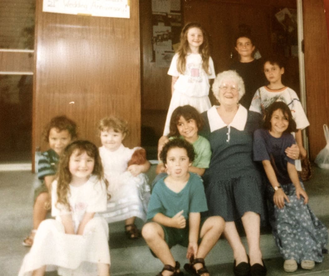 Elizabeth Beattie (top left) with her Nana, Marjorie, and family and friends