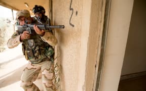 Iraqi troops training in urban clearances and tactics.