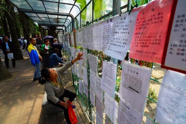 Informally organised marriage markets listing eligible bachelors remain a common sight in major Chinese cities.