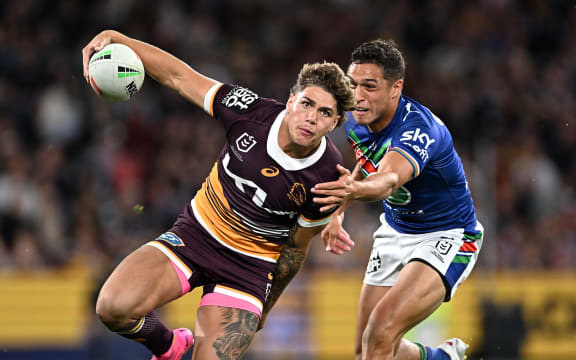 Broncos player Reece Walsh gets past Te Maire Martin of the Warriors  during the NRL preliminary final between the Brisbane Broncos and the New Zealand Warriors at Suncorp Stadium in Brisbane, Saturday, September 23, 2023. (AAP Image/Dave Hunt/www.photosport.nz)
