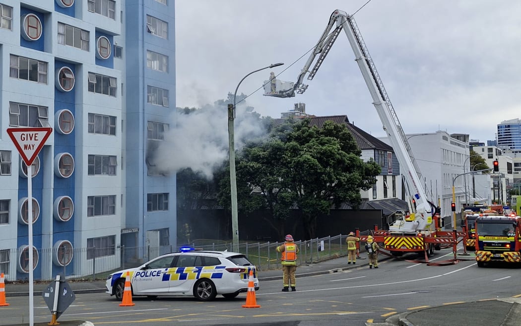 Smoke billows from the single apartment fire in the Pukehinau flats.