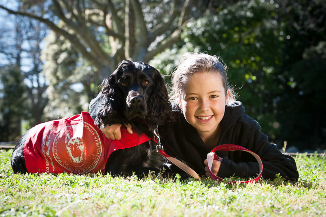 Esther and her medical response dog, Molly.