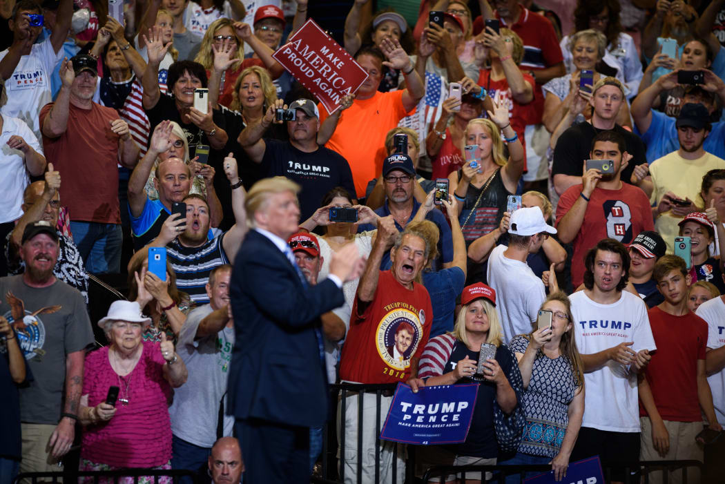 The crowd cheers US President Donald Trump at the Big Sandy Superstore Arena in Huntington, West Virginia.