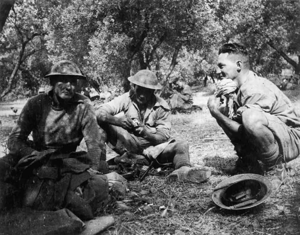 Soldiers shelter amongst olive trees on Crete.
