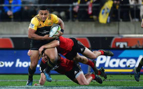 Hurricane Ngani Laumape takes on the Crusaders' line.
