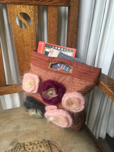 A member of Annette Hill's book group crafted book bags for members that are given to them when they join.