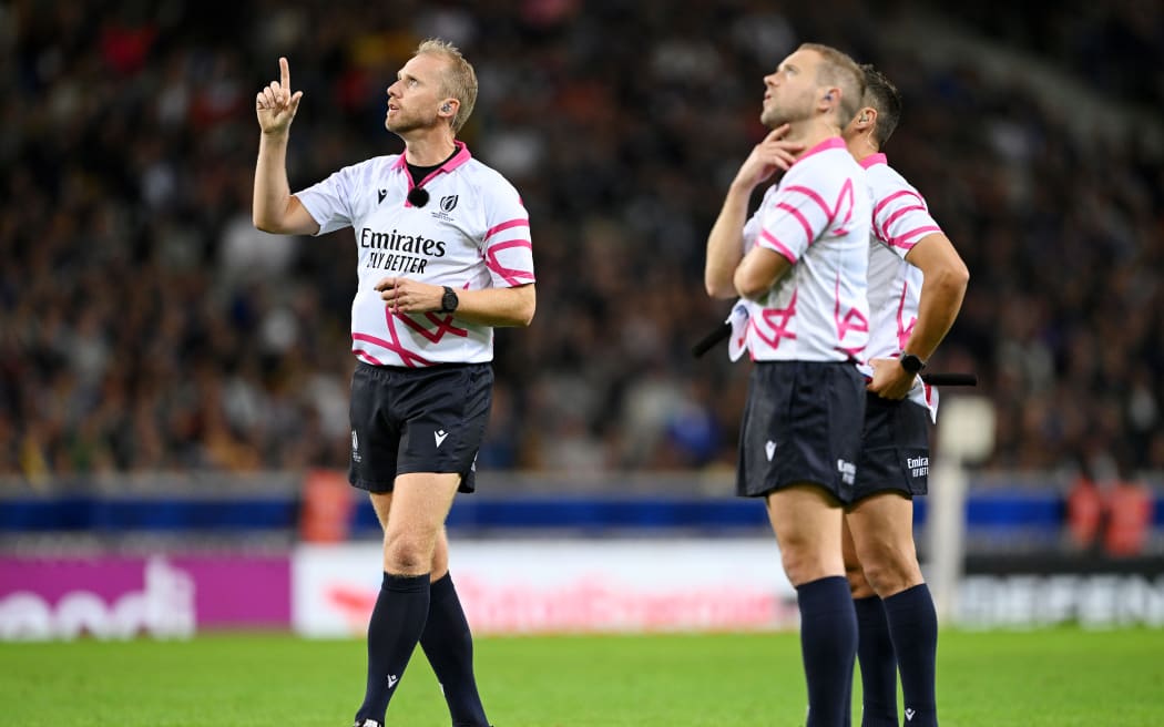Referee Wayne Barnes watches a TMO Review with Assistant Referee James Doleman and Assistant Referee Angus Gardner during the Rugby World Cup France 2023.
