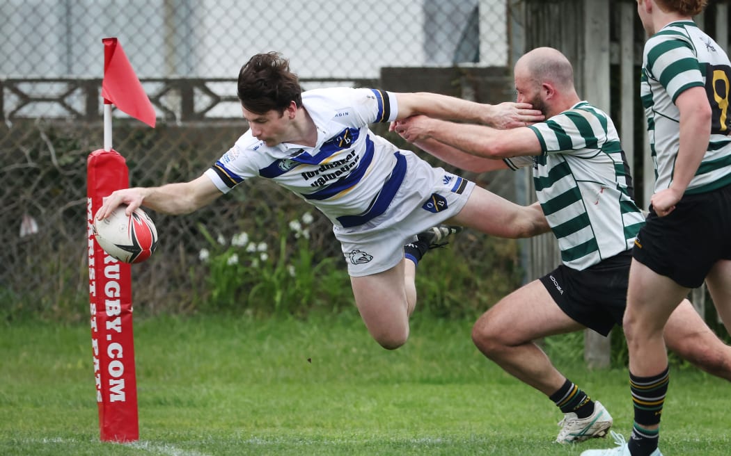 Tom Anderson of HSOB, scores a try.