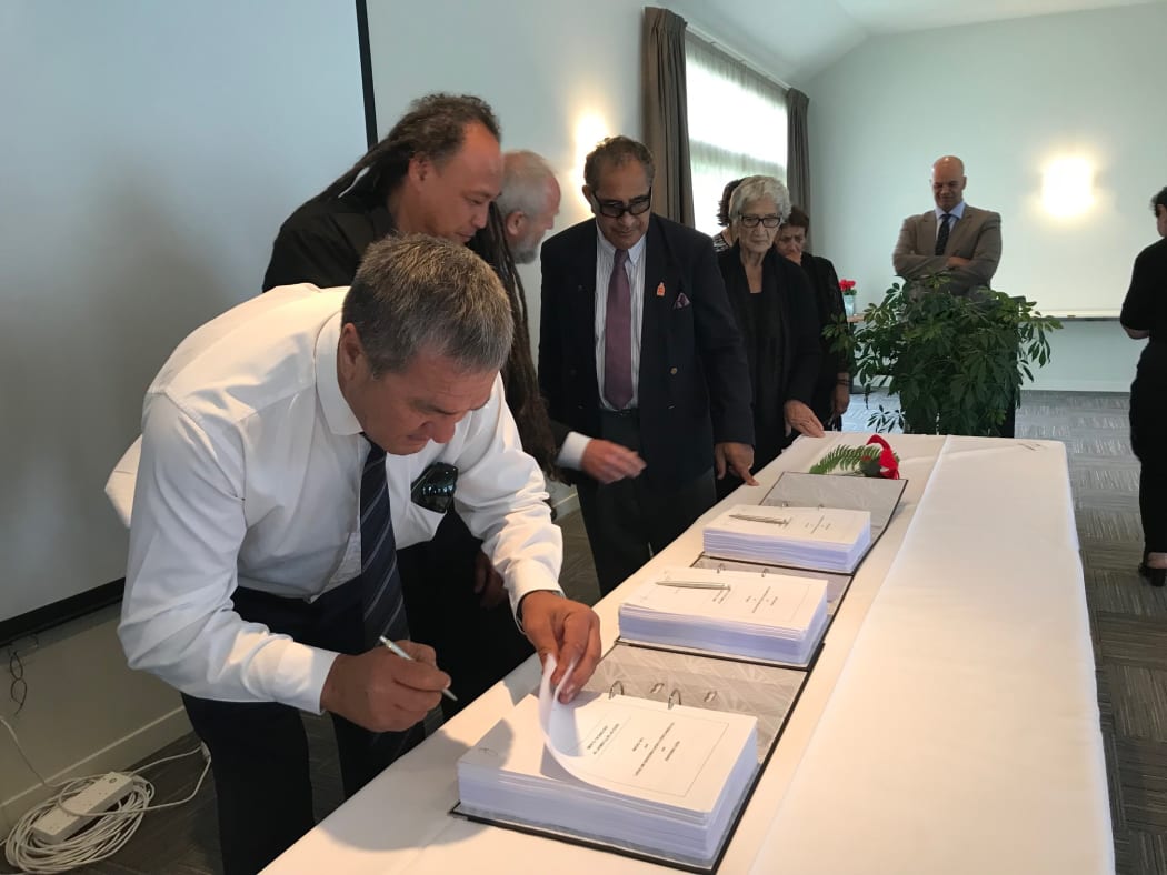 Ngāti Hinerangi trustee Philip Samuels initialling the Ngāti Hinerangi Deed of Settlement in December