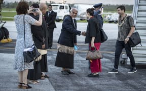 Jacinda Ardern and her partner, Clarke Gayford, are welcomed after landing in Tonga.