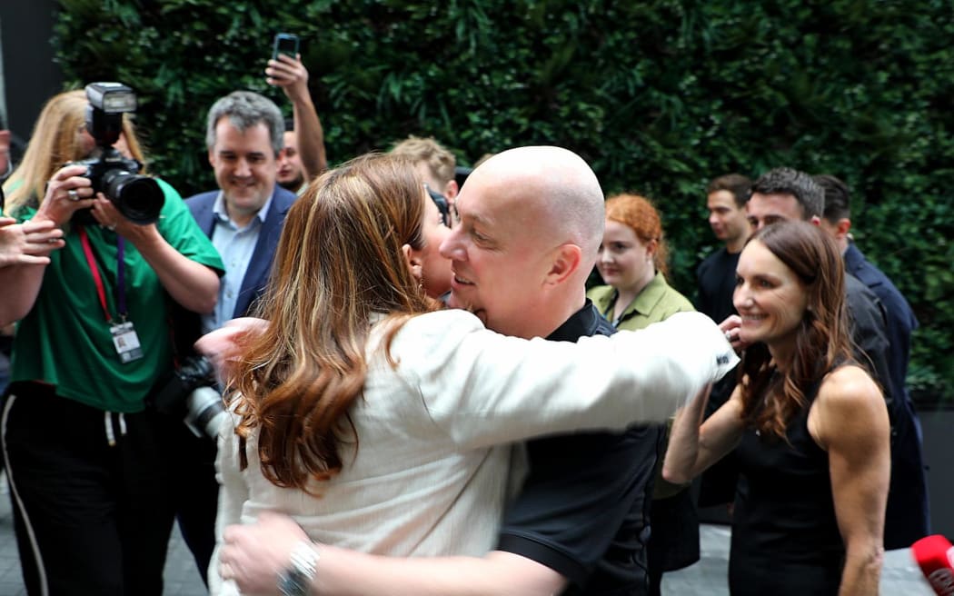 National Party leader Christopher Luxon hugs his deputy, Nicola Willis, after election night results on 15 October, 2023.