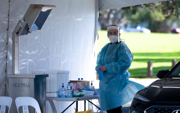 A health worker attends to duties to Devonport testing station.