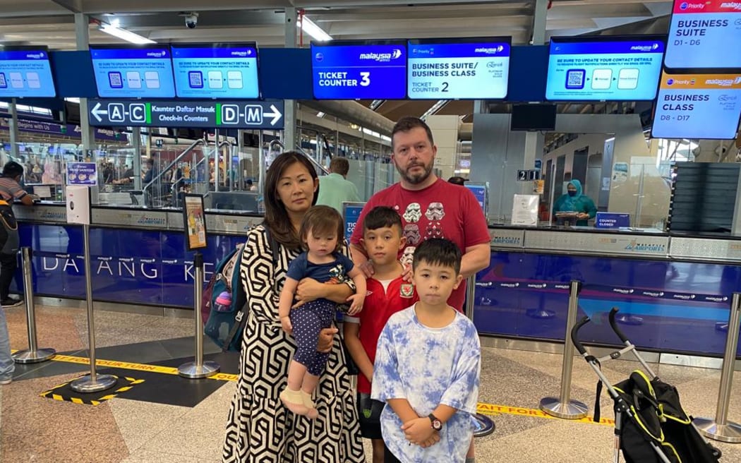 Dr Dan Cocker, his wife Dr Eileen Liew, 10yo son Rhys Cocker, 8yo son Felix Cocker and 15-month-old daughter Eva-Mae Cocker had trouble with their flight because of Friday's flooding at Auckland Airport.