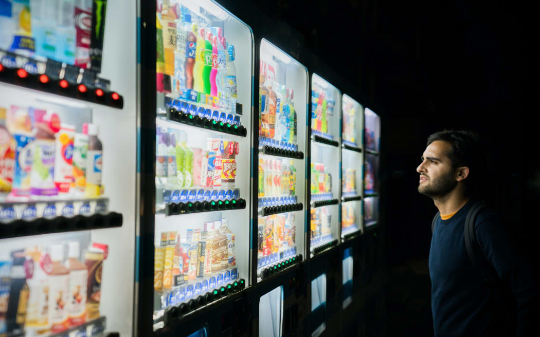 man at vending machine