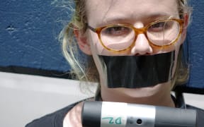 Tove Partington protests a police decision not to charge anyone over the so-called Roastbusters case.