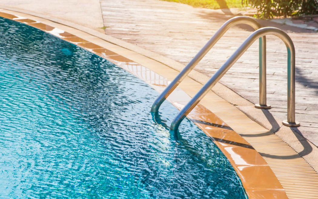 Modern backyard of a swimming pool in public resort or clubhouse