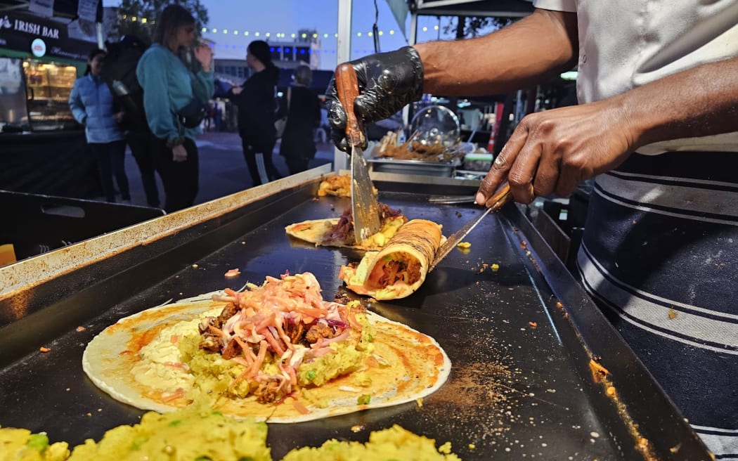 A chef makes dosa at a night market in Auckland. SINGLE USE ONLY