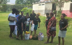 Seventh Day Adventist Church members in Vanuatu take supplies to stranded Solomon Islands nurses
