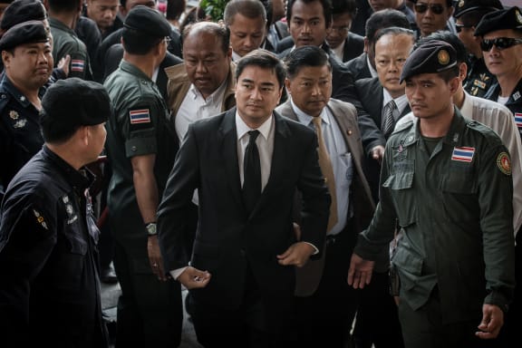 Former Thai PM Abhisit Vejjajiva arrives at court in Bangkok.