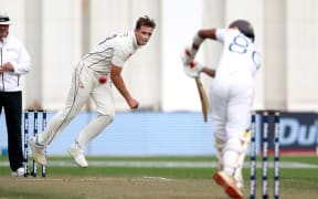 New Zealand captain Tim Southee, left, bowls to Sri Lanka's Oshada Fernando during day three of the second cricket Test match between New Zealand and Sri Lanka at the Basin Reserve in Wellington on 19 March, 2023.
