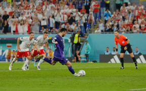Argentina's forward Lionel Messi takes a penalty shot during the Qatar 2022 World Cup Group C football match between Poland and Argentina at Stadium 974 in Doha on 30 November, 2022.