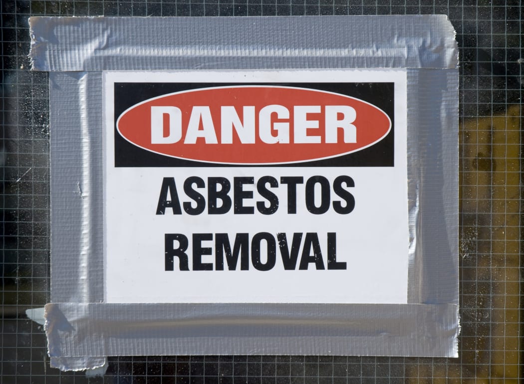 A file photo of a sign warning about asbestos removal