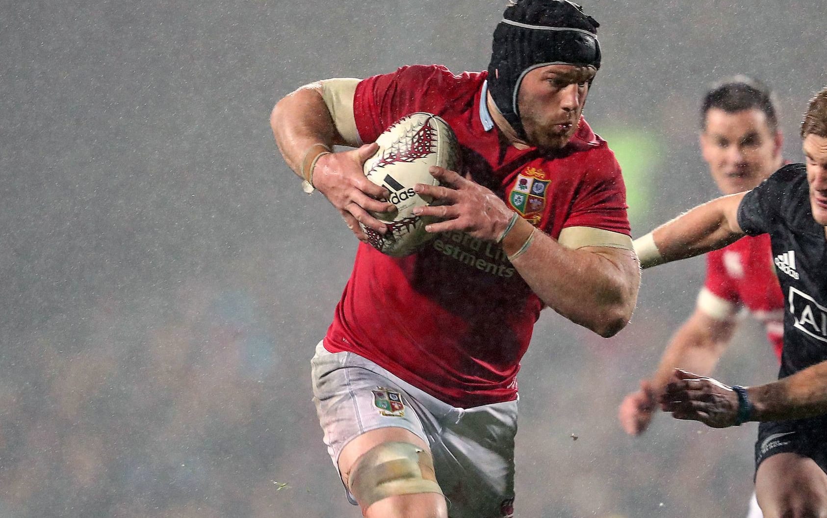 Lions' Sean O'Brien is chased by Damian McKenzie.