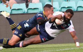 Marika Koroibete (r) scores for the Rebels in the tackle of Highlanders halfback Aaron Smith