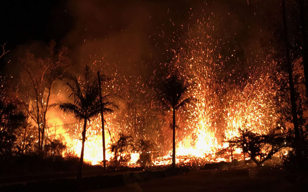 A volcanic fissure with lava fountains as high as about 70m in Leilani Estates, Hawaii.