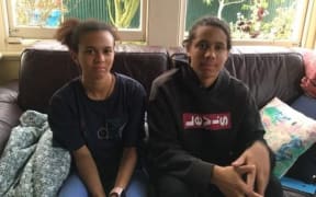 Lewis O’Malley-Scott with cornrows sitting beside his sister Ori.