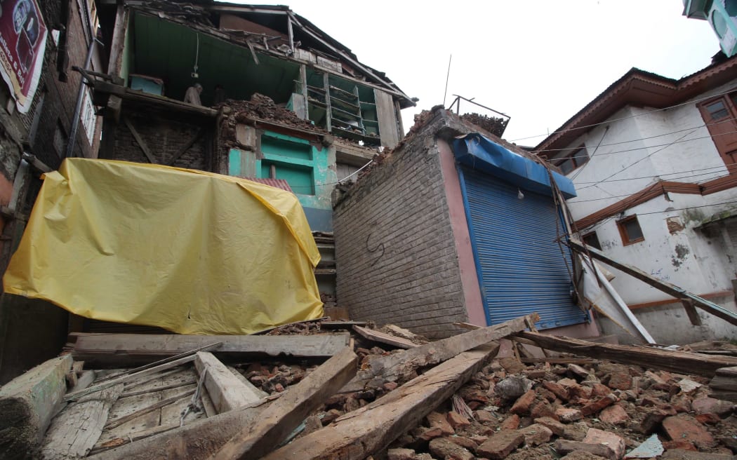 A residential house shows damage in a powerful earthquake in Srinagar, the summer capital of Indian-controlled Kashmir.