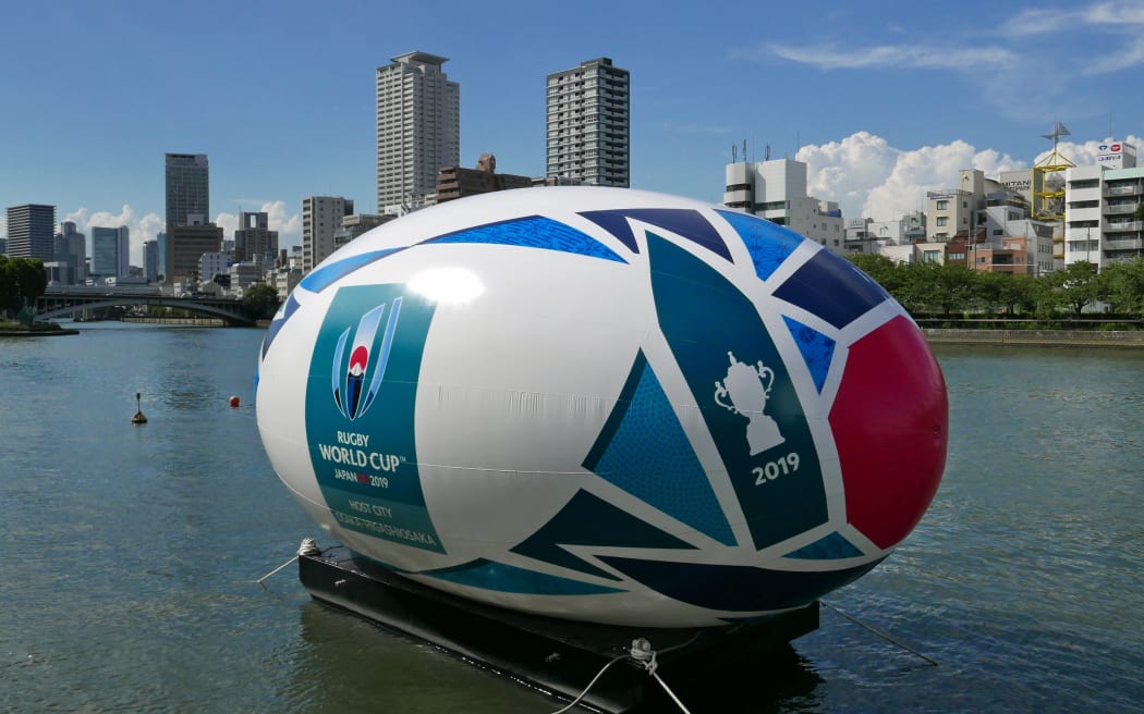 A giant rugby ball balloon floats on a river to promote the Rugby World Cup in Osaka,.