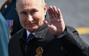 Russian President Vladimir Putin leaves Red Square after the Victory Day military parade in central Moscow on May 9, 2022.