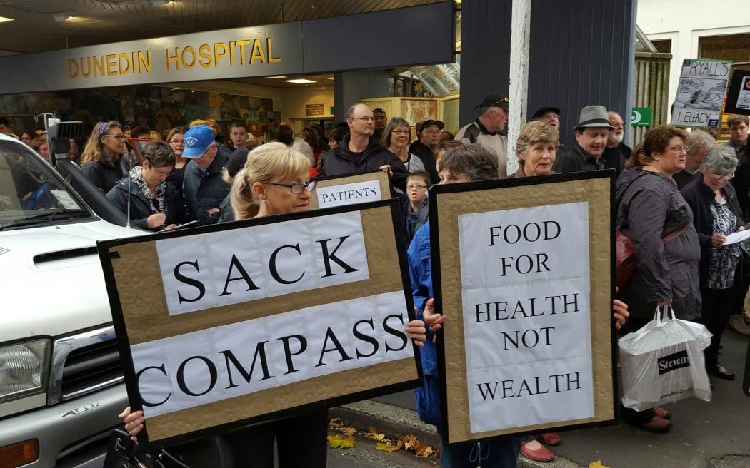 Protesters want the 15-year contract with Compass to be scrapped.