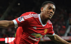Manchester United's Anthony Martial celebrates after scoring their 3rd goal.