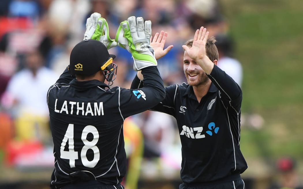 Kane Williamson celebrates with Tom Latham.