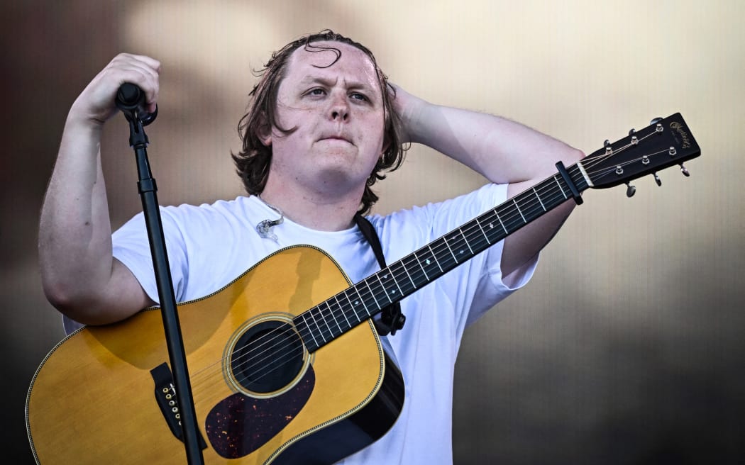 (FILES) Scottish singer Lewis Capaldi performs on The Pyramid Stage on day 4 of the Glastonbury festival in the village of Pilton in Somerset, southwest England, on June 24, 2023. Scottish singer-songwriter Lewis Capaldi on June 27 said he was taking a break from performing, after struggling to finish his set at the Glastonbury festival. The crowd at the event on Saturday stepped in to sing the lyrics to his final songs after Capaldi, 26, suffered vocal problems. (Photo by Oli SCARFF / AFP)