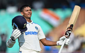 India's Yashasvi Jaiswal celebrates after scoring a century (100 runs) during the third day of the third Test cricket match between India and England at the Niranjan Shah Stadium in Rajkot on February 17, 2024. (Photo by Punit PARANJPE / AFP) / -- IMAGE RESTRICTED TO EDITORIAL USE - STRICTLY NO COMMERCIAL USE --