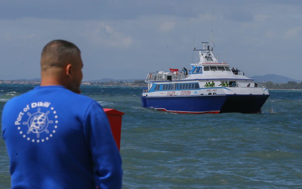 A small Turkish ferry carrying 13 migrants deported from Greece's Lesbos Island to Turkey, arrives at Dikili harbor in Izmir.