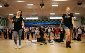 Dancers Caitlin Martin (left) and Tennille Arthur lead a class of line dancers in Christchurch.