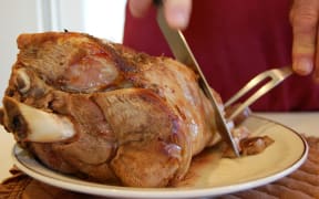 roast lamb being carved