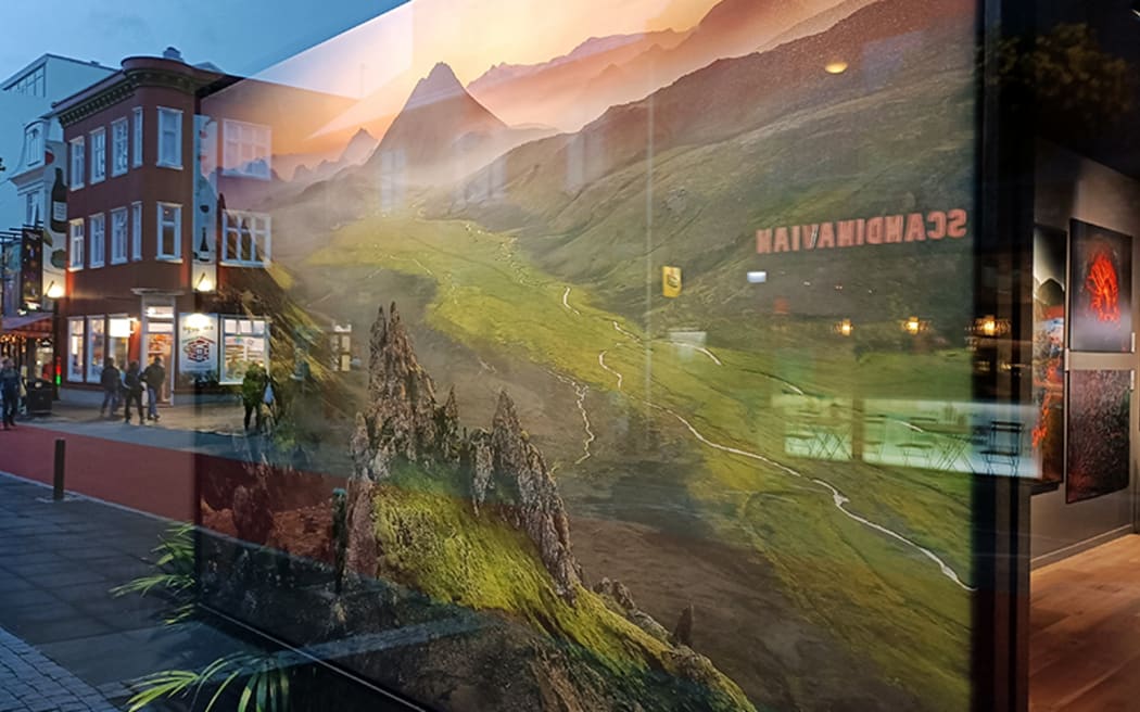 Iceland scene reflected in a shop window.