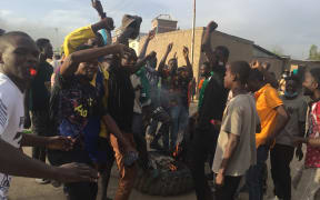 Demonstrators shout slogan during a protest in N’Djamena on October 20, 2022. - Clashes erupted in the Chadian capital N'Djamena between police and hundreds of demonstrators at a banned protest over the ruling junta's grip on power, an AFP journalist saw. Five people "died from gunshots" in clashes Thursday between police and demonstrators in the Chadian capital N'Djamena, the head doctor at the city's Union Chagoua Hospital, Joseph Ampil, told AFP. (Photo by AFP)