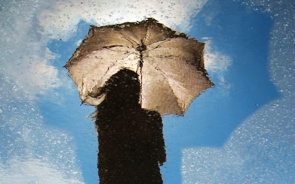 woman with umbrella in the sun
